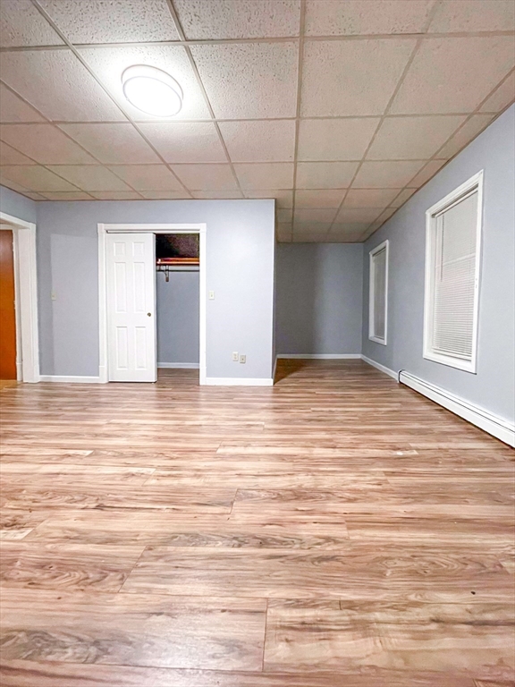 42 Mammoth Road Lowell, MA 01854 - Photo 4 of 15 a view of an empty room with wooden floor