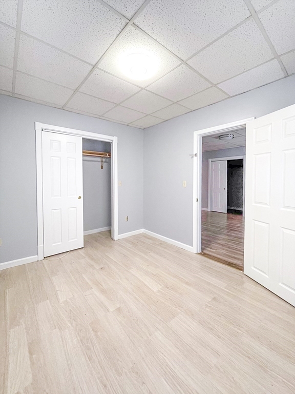 42 Mammoth Road Lowell, MA 01854 - Photo 5 of 15 a view of an empty room with wooden floor