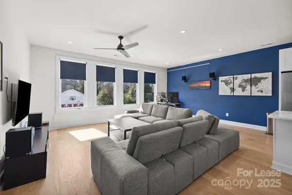 a living room with furniture fireplace and a flat screen tv