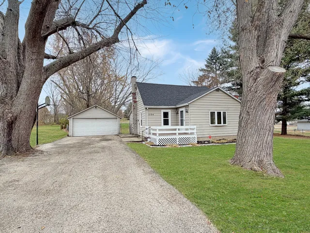 a view of house with a yard