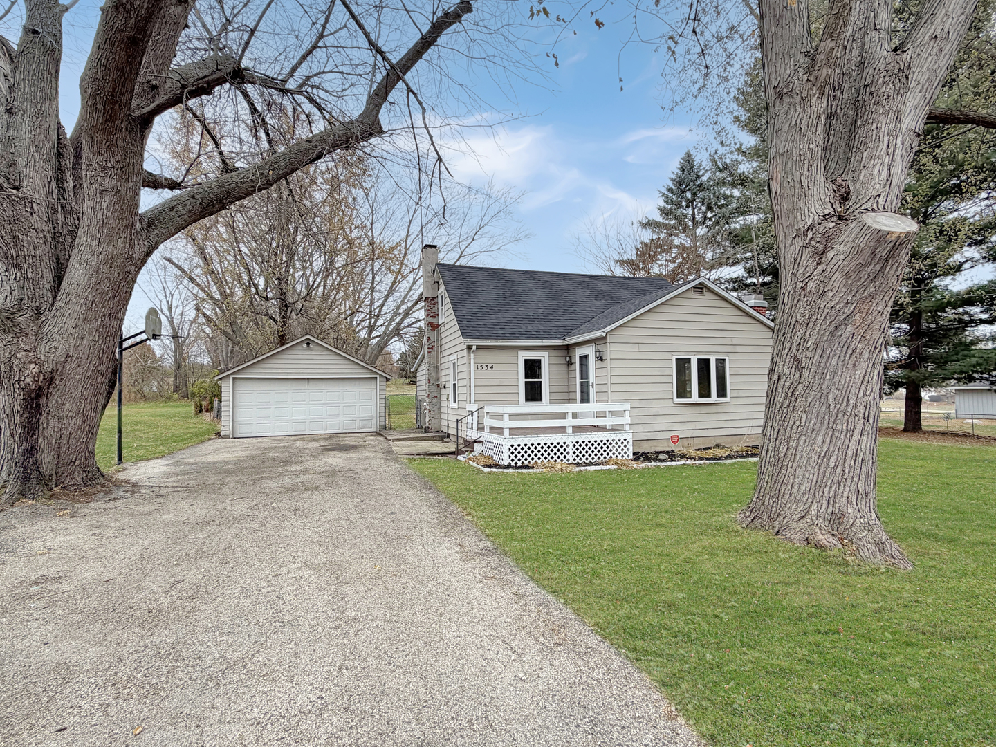 a view of house with a yard