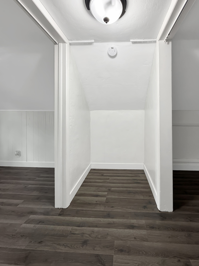 1534 West Fairview Road Freeport, IL 61032 - Photo 17 of 30 a view of an empty room with wooden floor