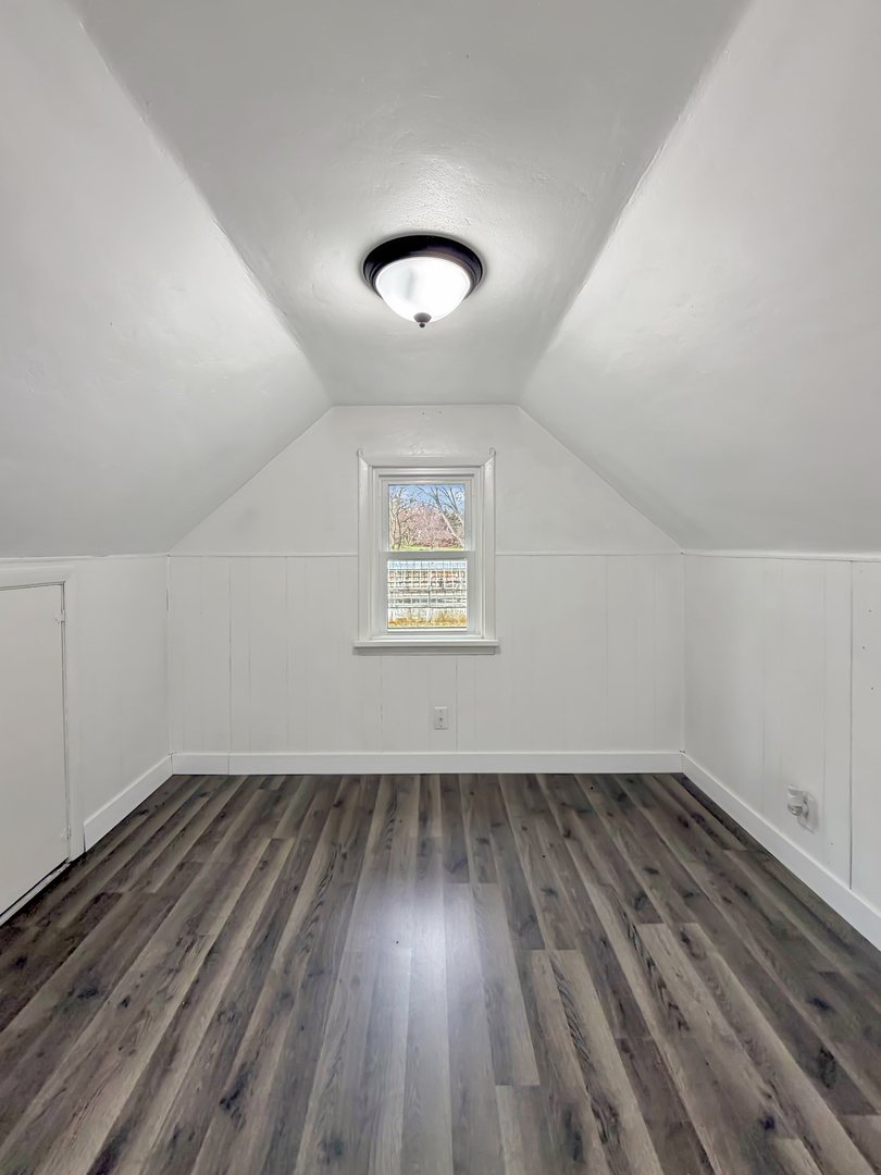 1534 West Fairview Road Freeport, IL 61032 - Photo 19 of 30 wooden floor in an empty room with a window