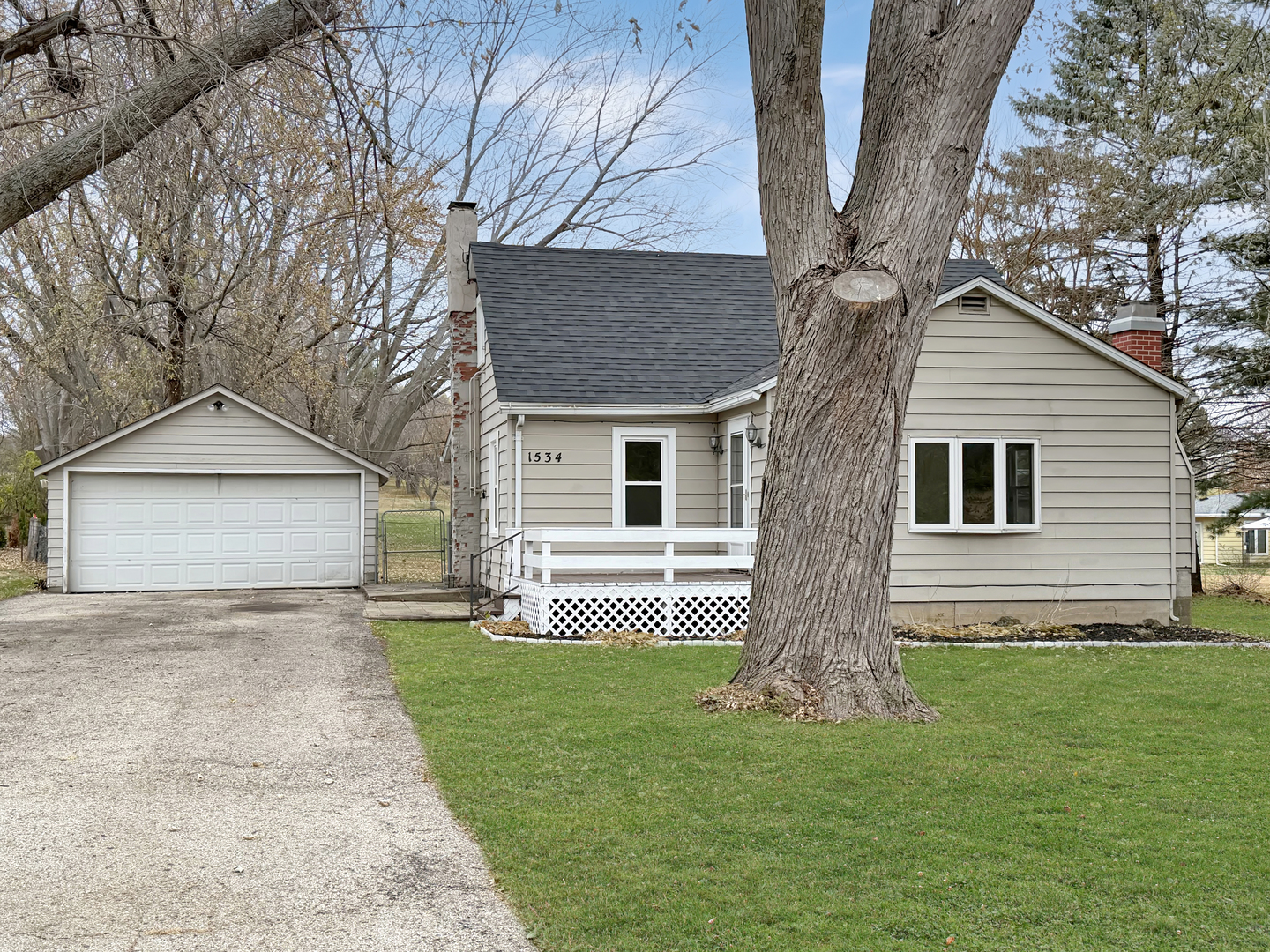 1534 West Fairview Road Freeport, IL 61032 - Photo 23 of 30 a front view of a house with a yard and garage