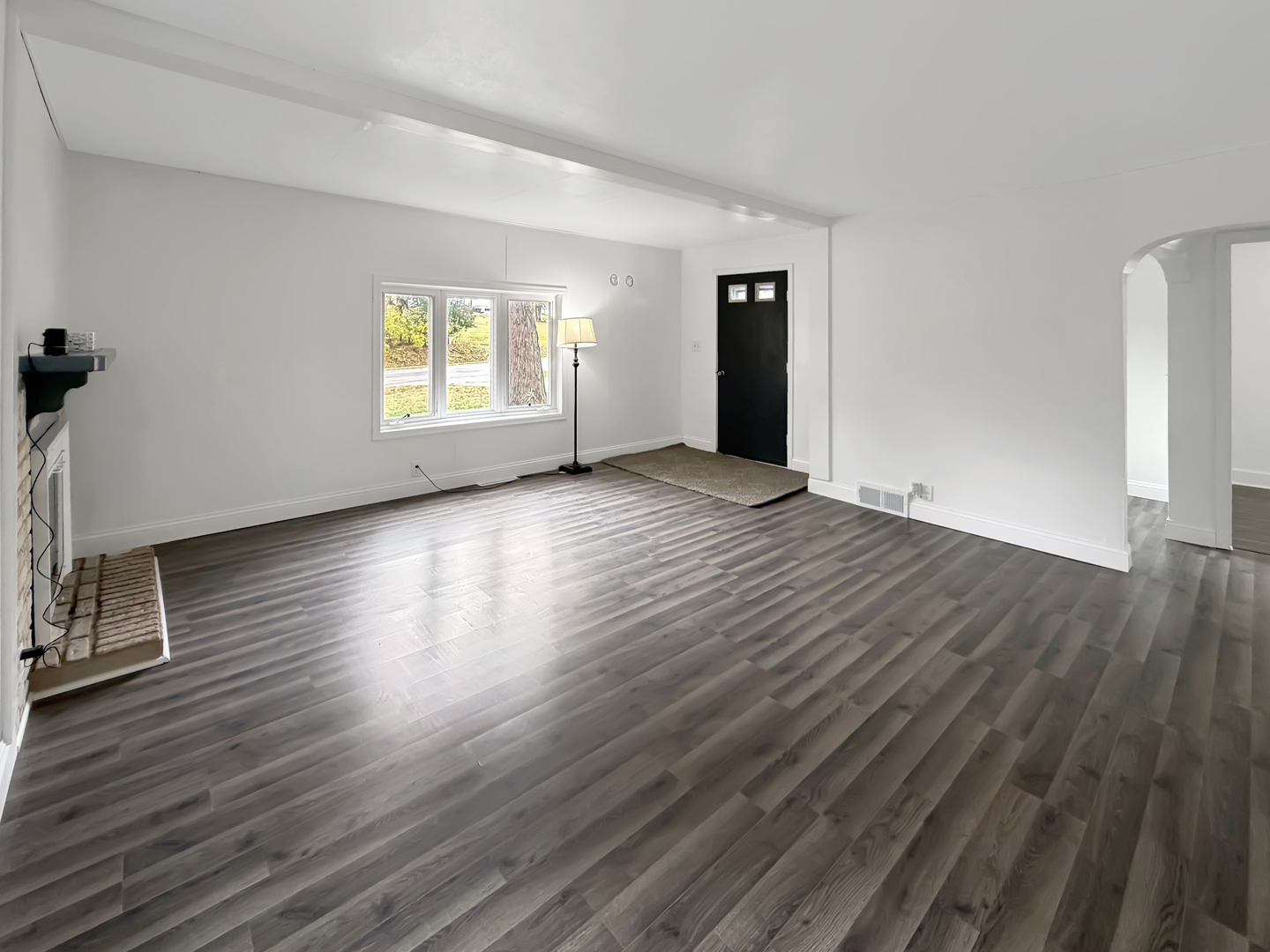 1534 West Fairview Road Freeport, IL 61032 - Photo 3 of 30 an empty room with wooden floor and windows