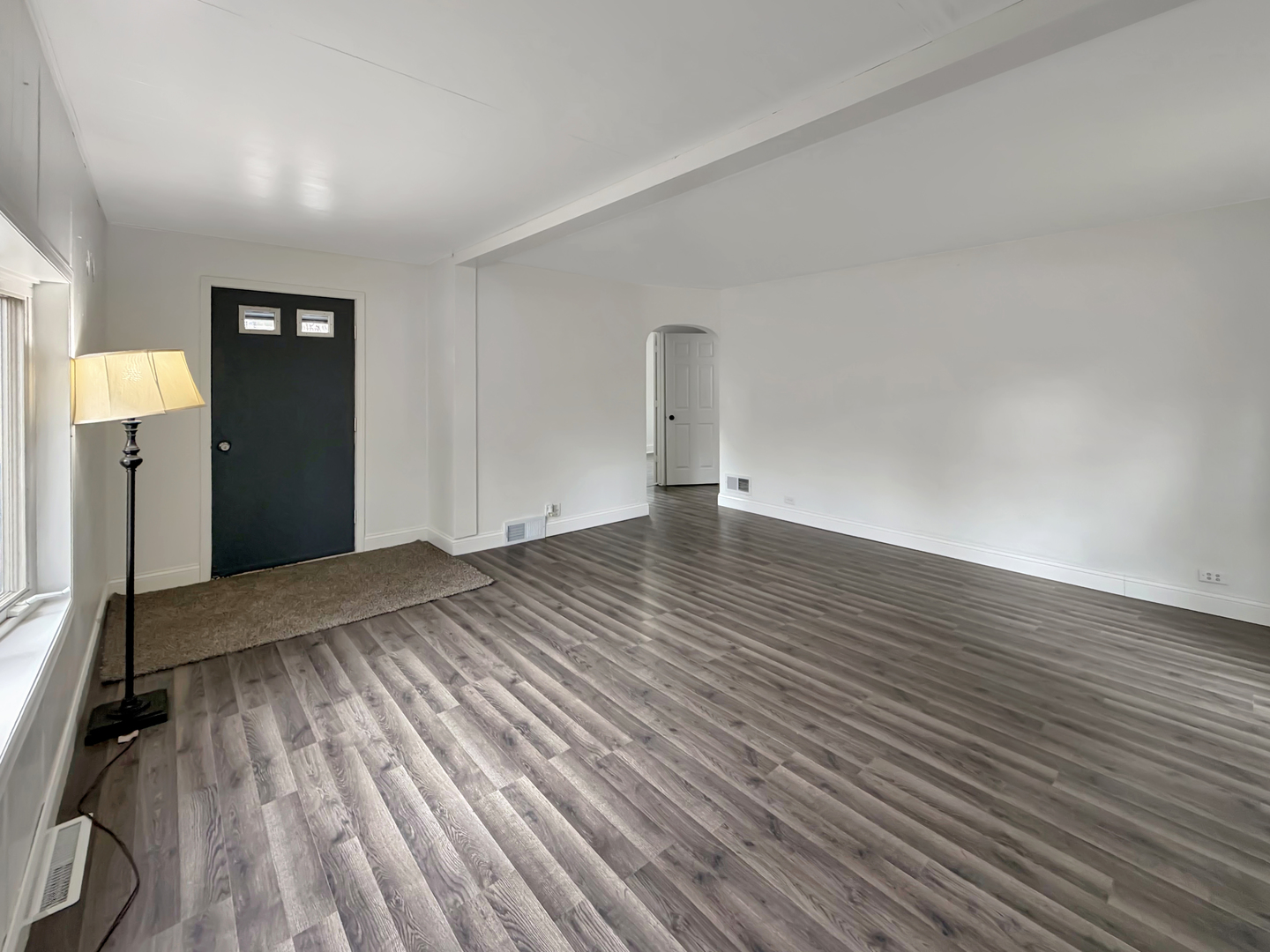 1534 West Fairview Road Freeport, IL 61032 - Photo 6 of 30 a view of an empty room with wooden floor