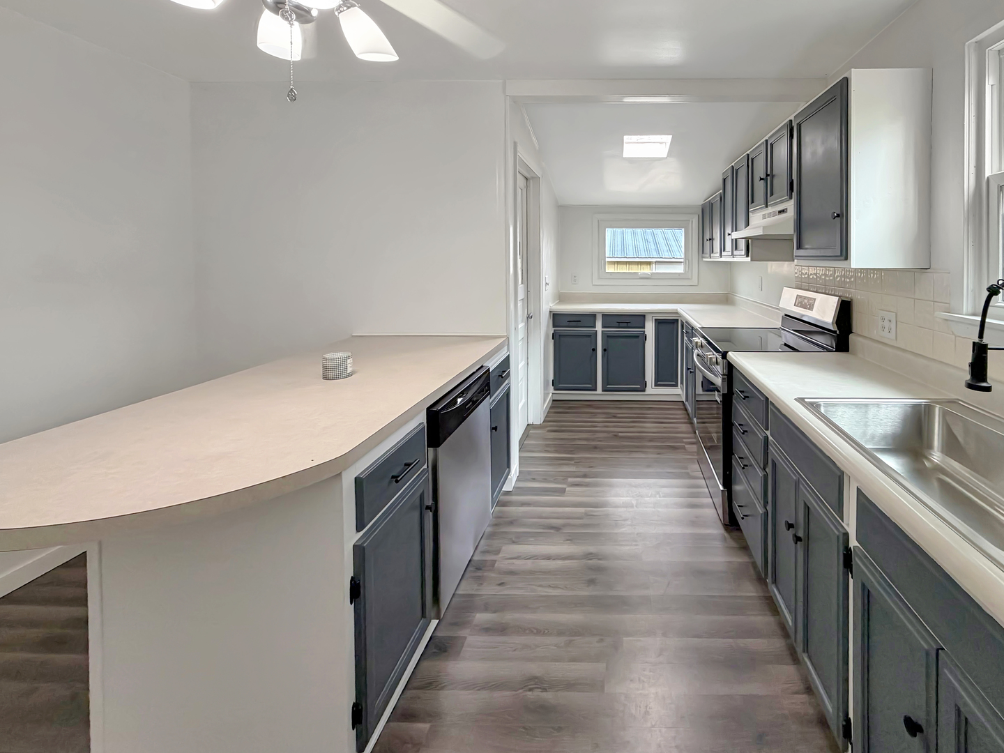 1534 West Fairview Road Freeport, IL 61032 - Photo 8 of 30 a kitchen with stainless steel appliances a sink stove top oven and cabinets