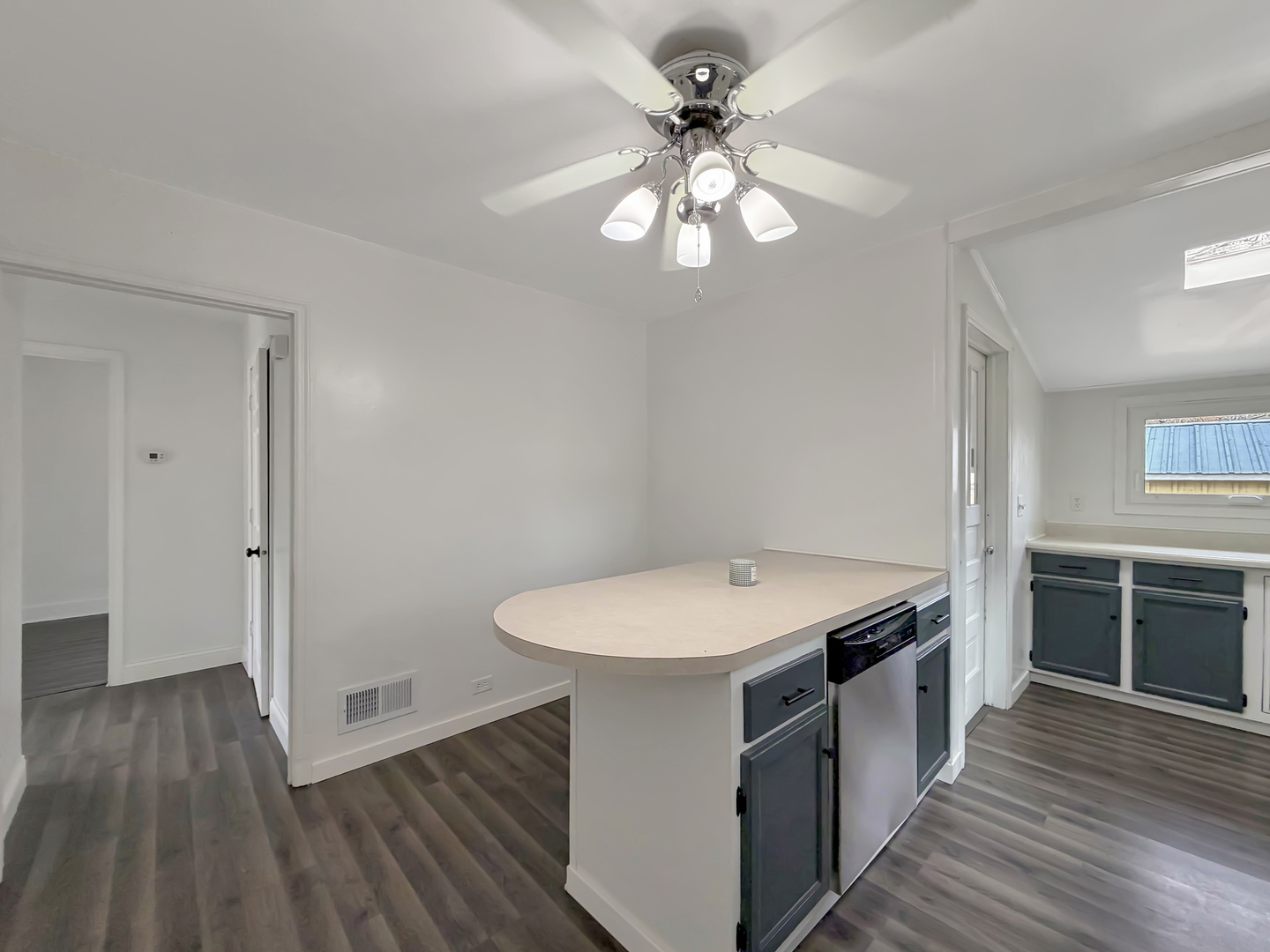 1534 West Fairview Road Freeport, IL 61032 - Photo 9 of 30 a kitchen with a stove and wooden floor