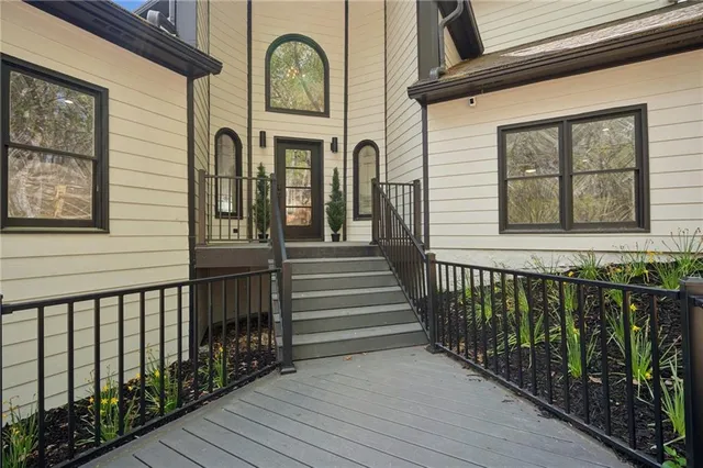 a view of a brick house with large windows