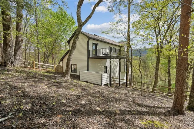 a view of a big yard with lots of bushes