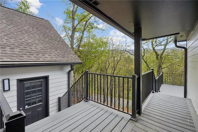 a view of entryway with wooden floor and stairs