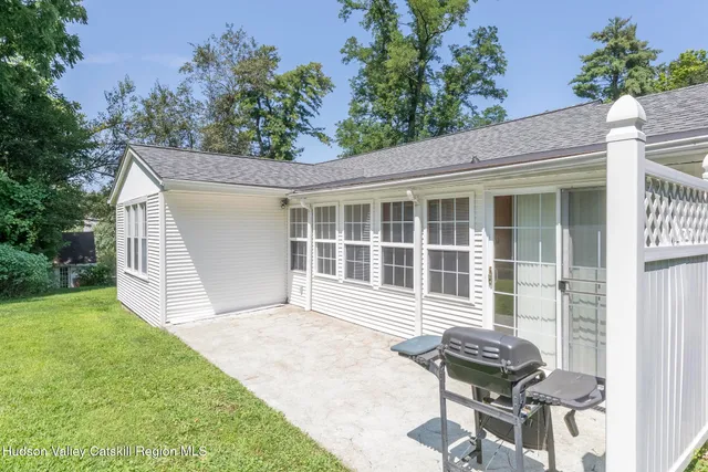 a front view of a house with outdoor seating