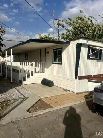 a patio with a table and chairs