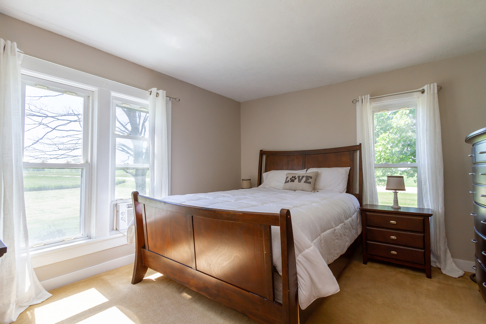 4783 Cherry Valley Road Kirkland, IL 60146 - Photo 13 of 41 a bedroom with a bed and large windows