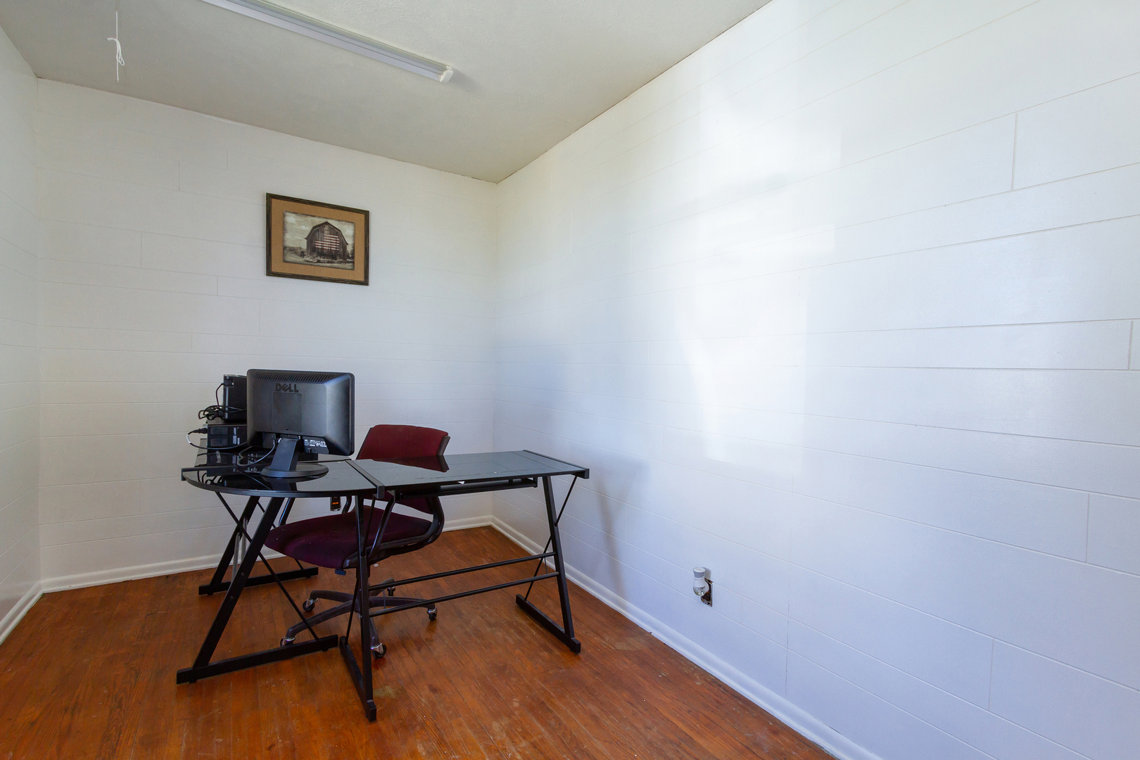 4783 Cherry Valley Road Kirkland, IL 60146 - Photo 14 of 41 a workspace with furniture and wooden floor