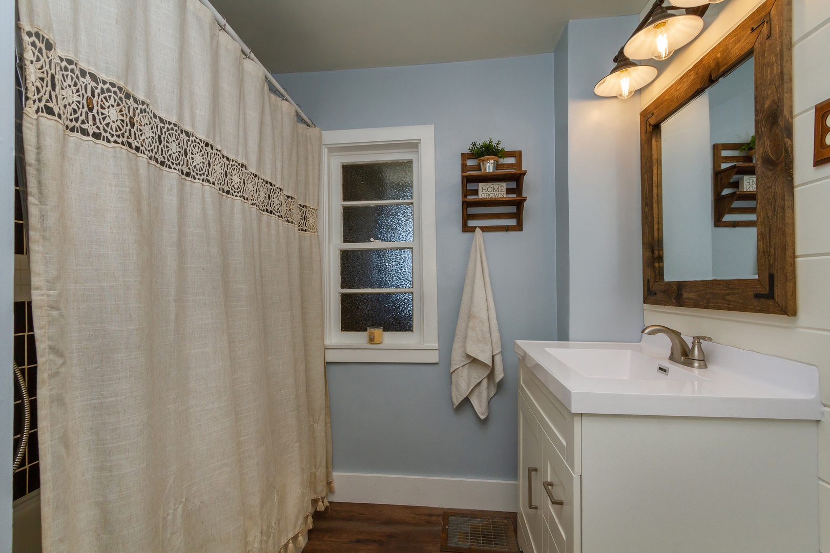 4783 Cherry Valley Road Kirkland, IL 60146 - Photo 17 of 41 a bathroom with a sink and mirror