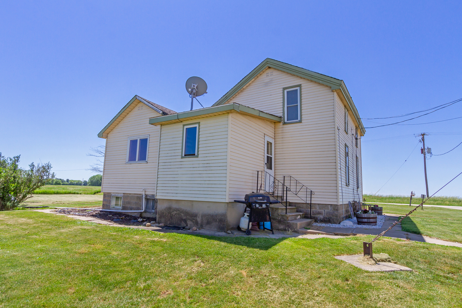 4783 Cherry Valley Road Kirkland, IL 60146 - Photo 23 of 41 a view of a house with a yard and sitting area