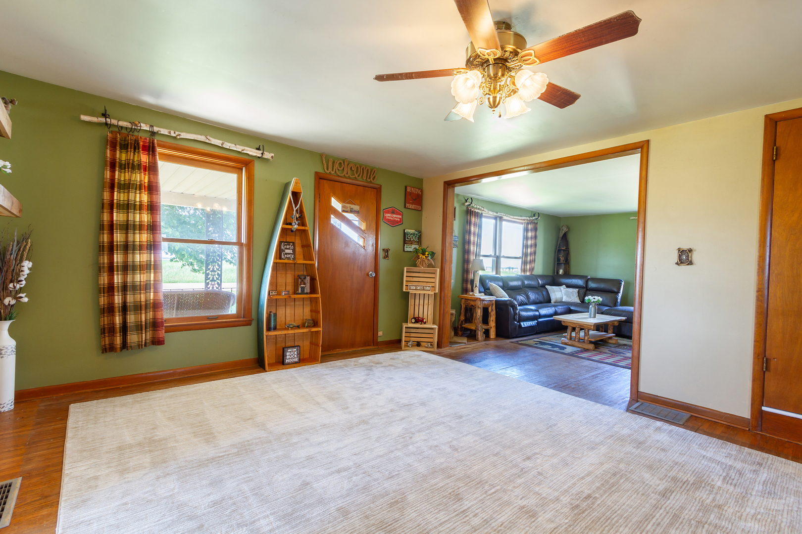 4783 Cherry Valley Road Kirkland, IL 60146 - Photo 6 of 41 a view of a livingroom with furniture and a ceiling fan