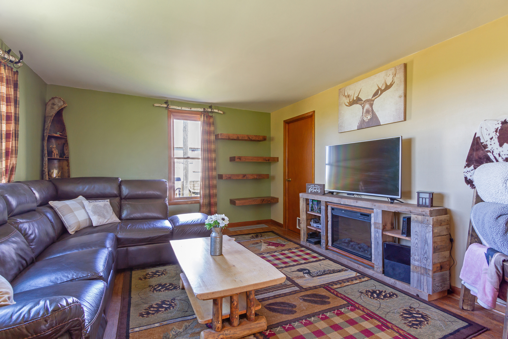 4783 Cherry Valley Road Kirkland, IL 60146 - Photo 9 of 41 a living room with furniture and a flat screen tv