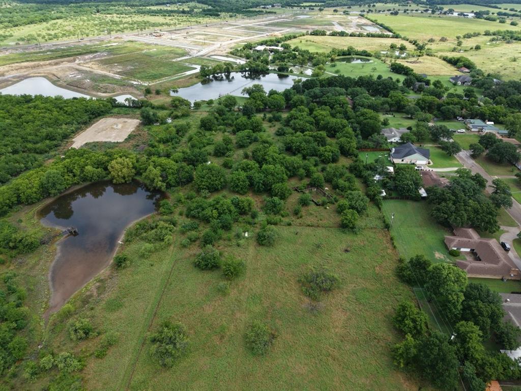 2965 Hartlee Field Road Denton, TX 76208 - Photo 4 of 6 a view of a garden with a lake