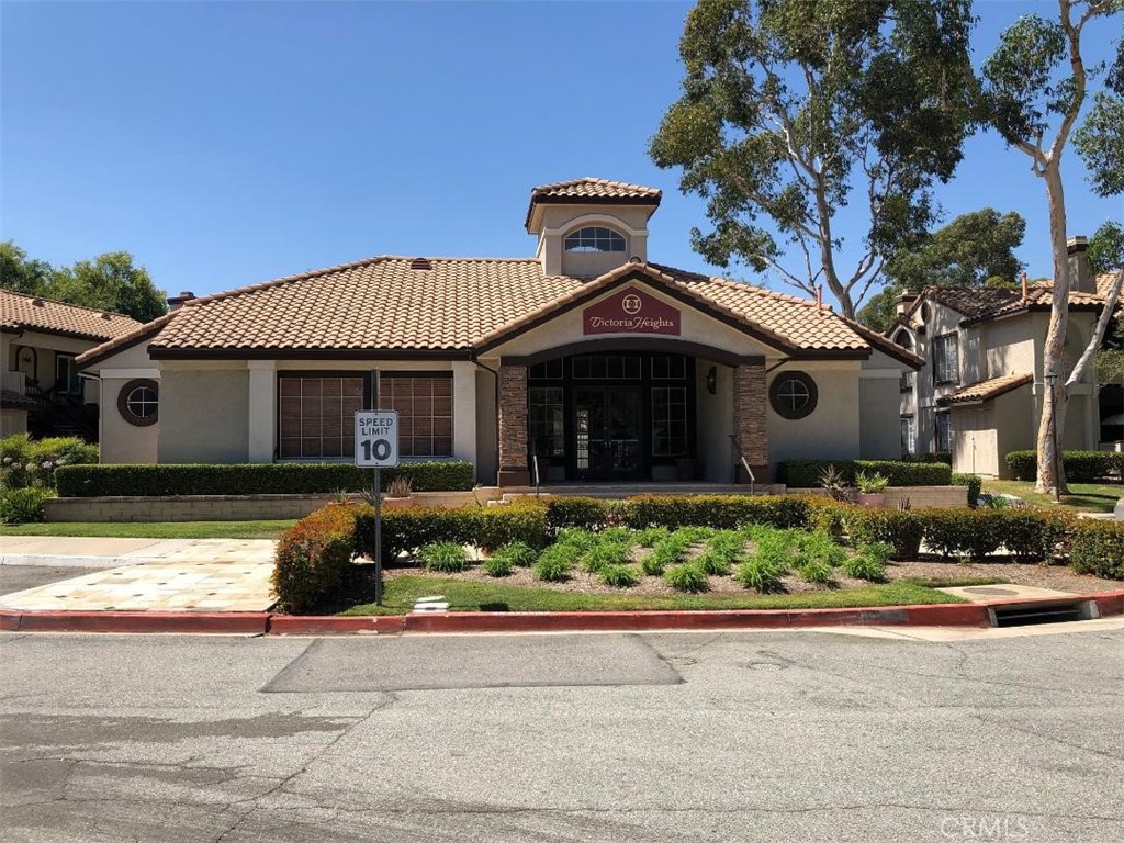 12584 Atwood Court, Unit 1824 Rancho Cucamonga, CA 91739 - Photo 11 of 15 a front view of a house with a yard and potted plants