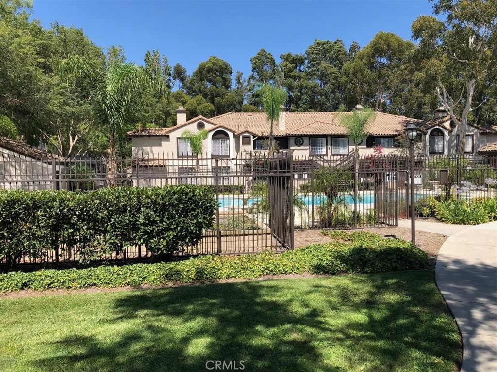 12584 Atwood Court, Unit 1824 Rancho Cucamonga, CA 91739 - Photo 14 of 15 a front view of a house with a garden