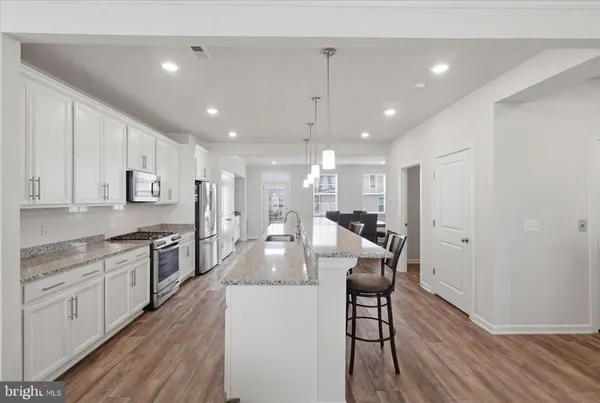 an aerial view of residential houses with outdoor space and street view