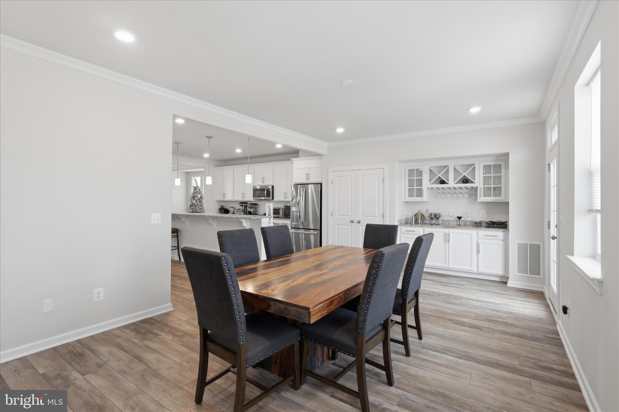 4932 MacDonough Place Frederick, MD 21703 - Photo 29 of 70 a view of a dining room with furniture and wooden floor