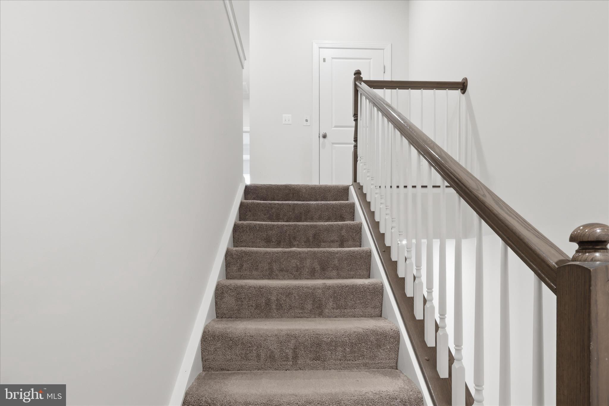 4932 MacDonough Place Frederick, MD 21703 - Photo 34 of 70 a view of staircase with white walls and white walls