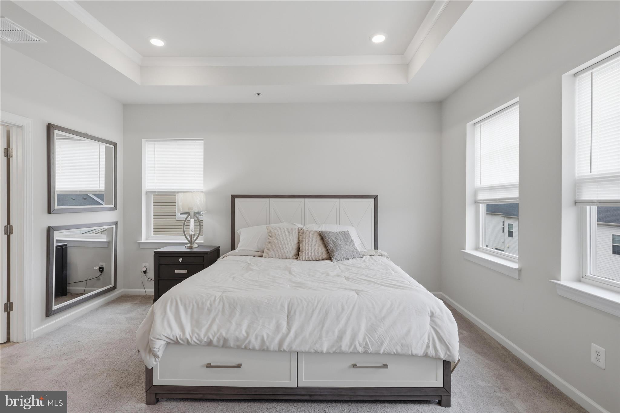 4932 MacDonough Place Frederick, MD 21703 - Photo 37 of 70 a bedroom with a large bed and wooden floor