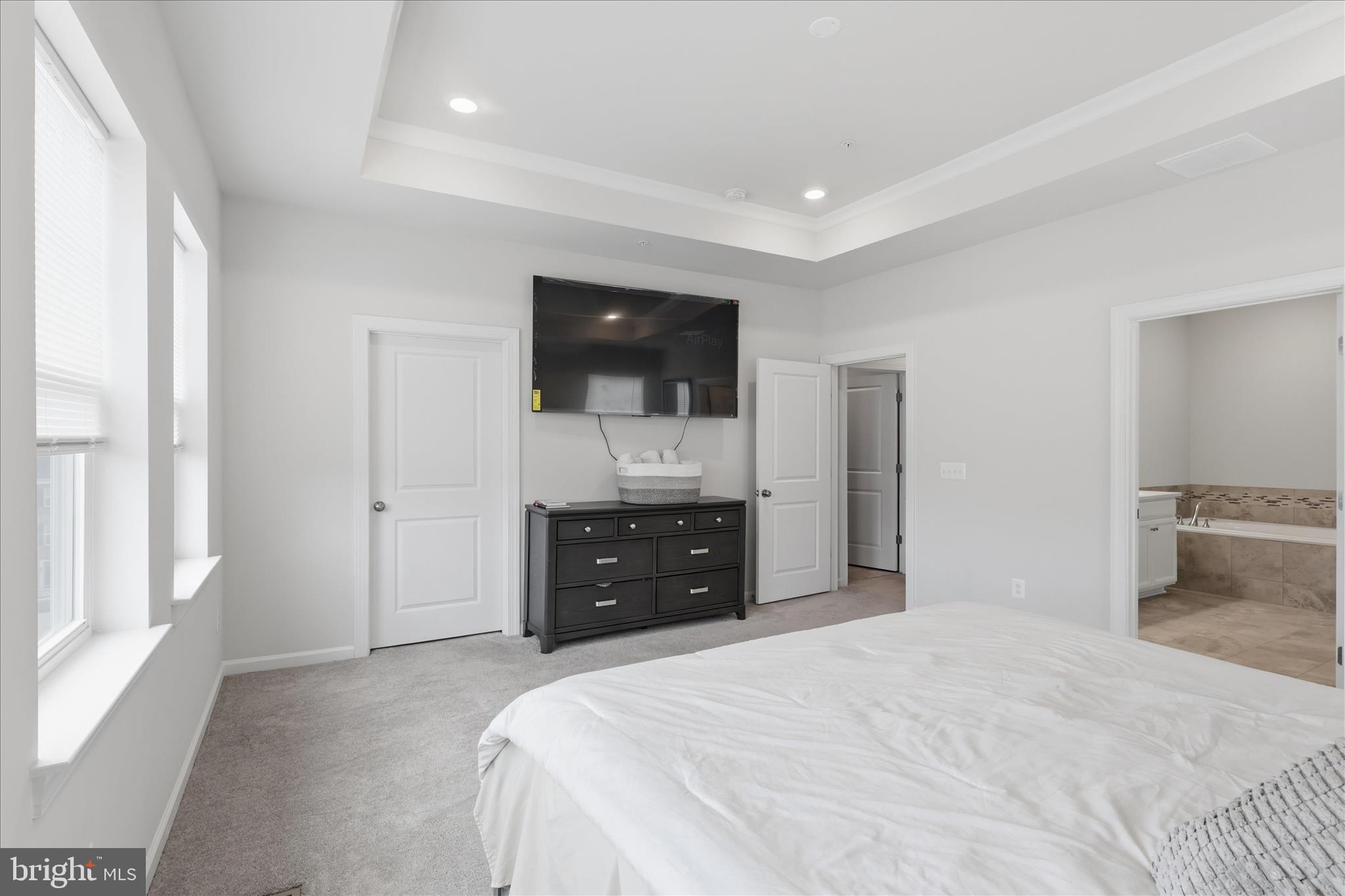 4932 MacDonough Place Frederick, MD 21703 - Photo 39 of 70 a bedroom with a bed and a flat screen tv