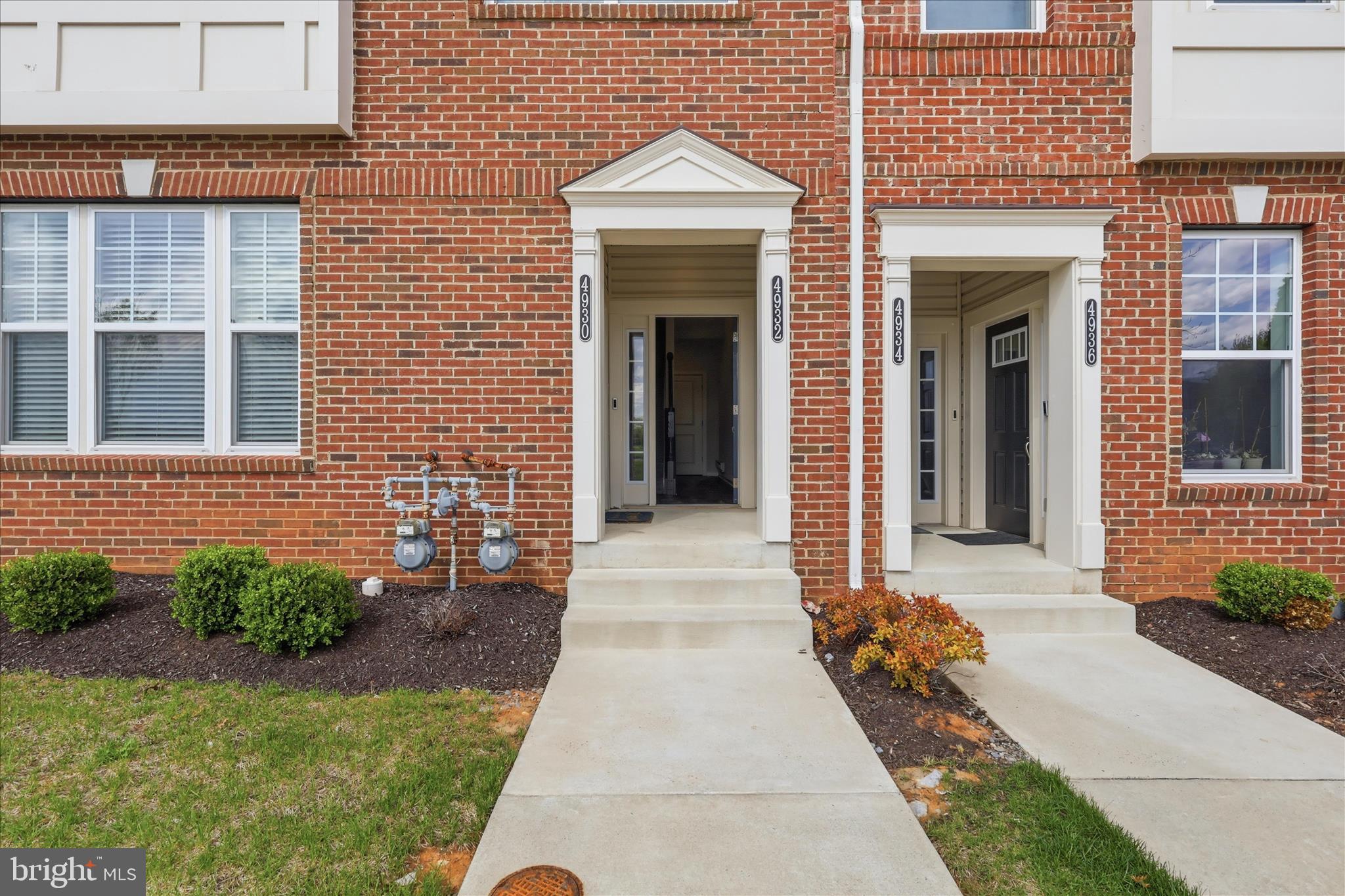 4932 MacDonough Place Frederick, MD 21703 - Photo 5 of 70 a front view of a house with a yard