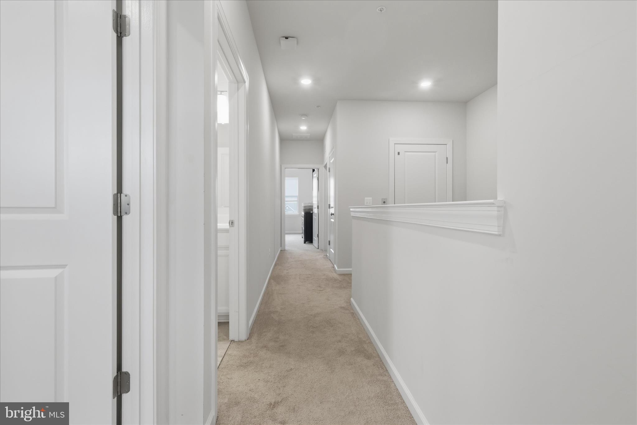 4932 MacDonough Place Frederick, MD 21703 - Photo 51 of 70 a view of a hallway with white walls