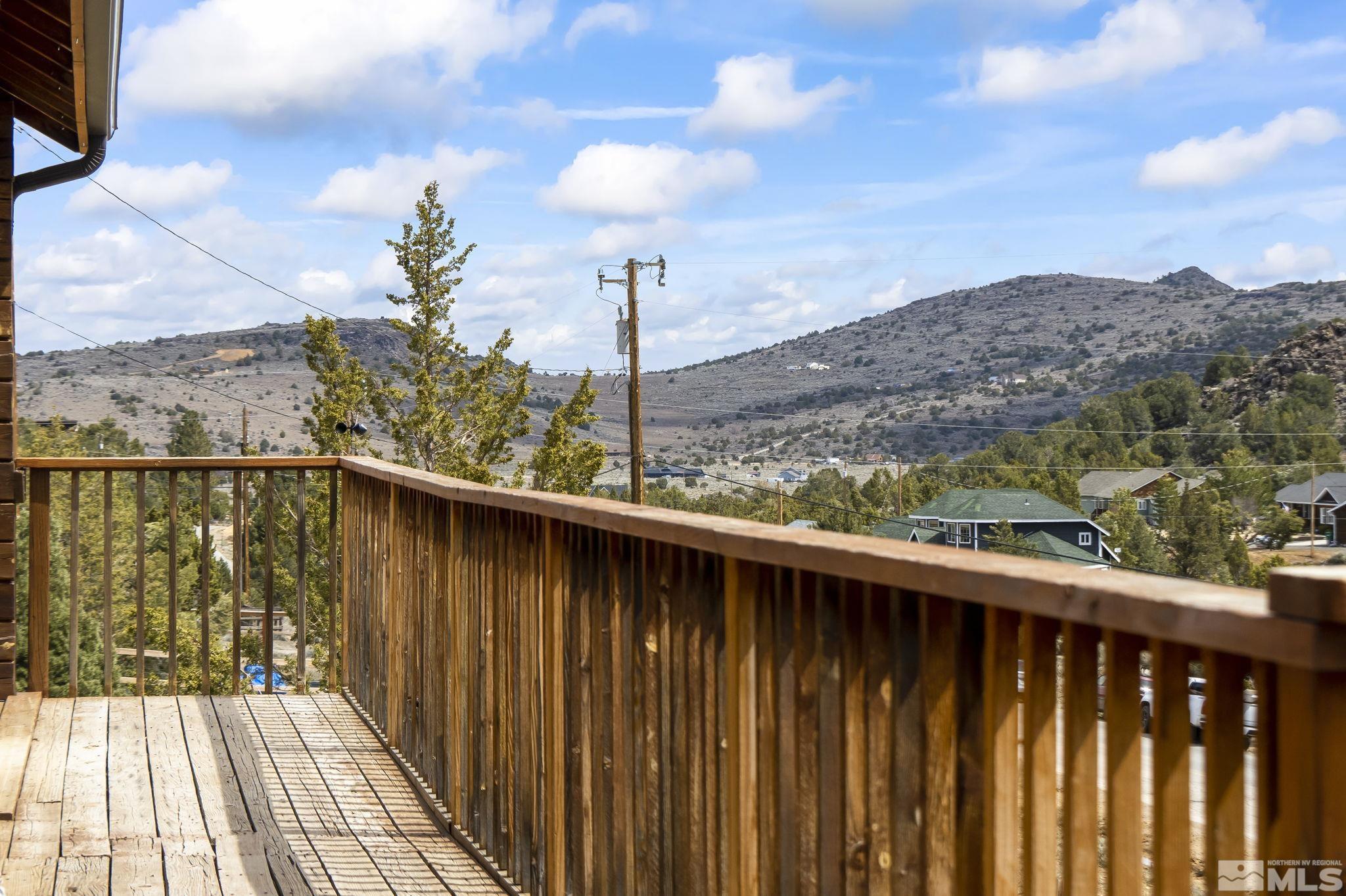 2200 Lousetown Road Reno, NV 89521 - Photo 25 of 40 a view of a balcony with wooden floor and fence