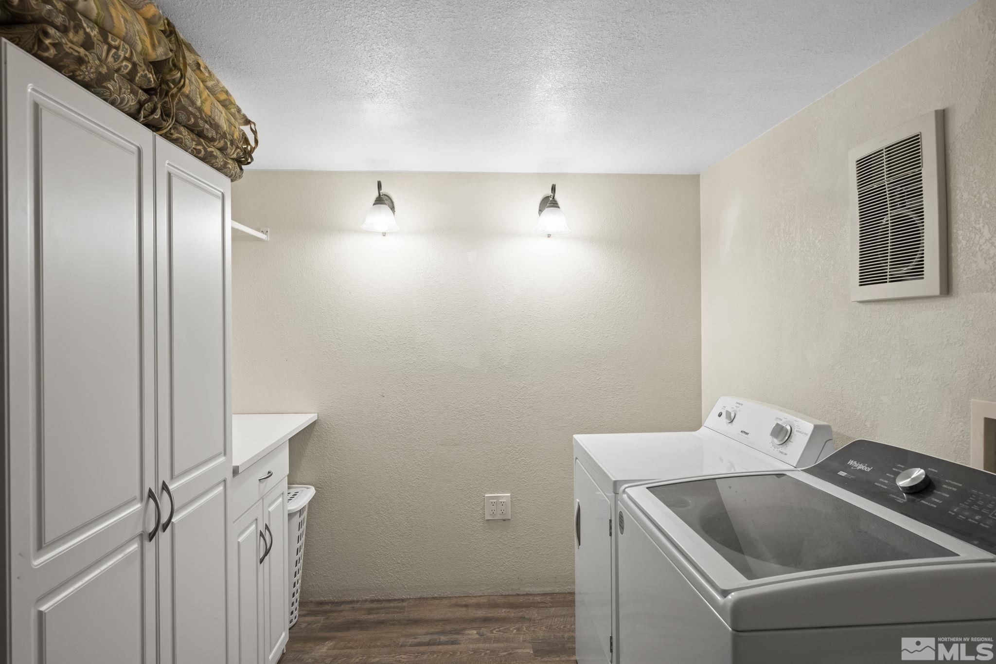 2200 Lousetown Road Reno, NV 89521 - Photo 27 of 40 a bathroom with a sink and washing machine