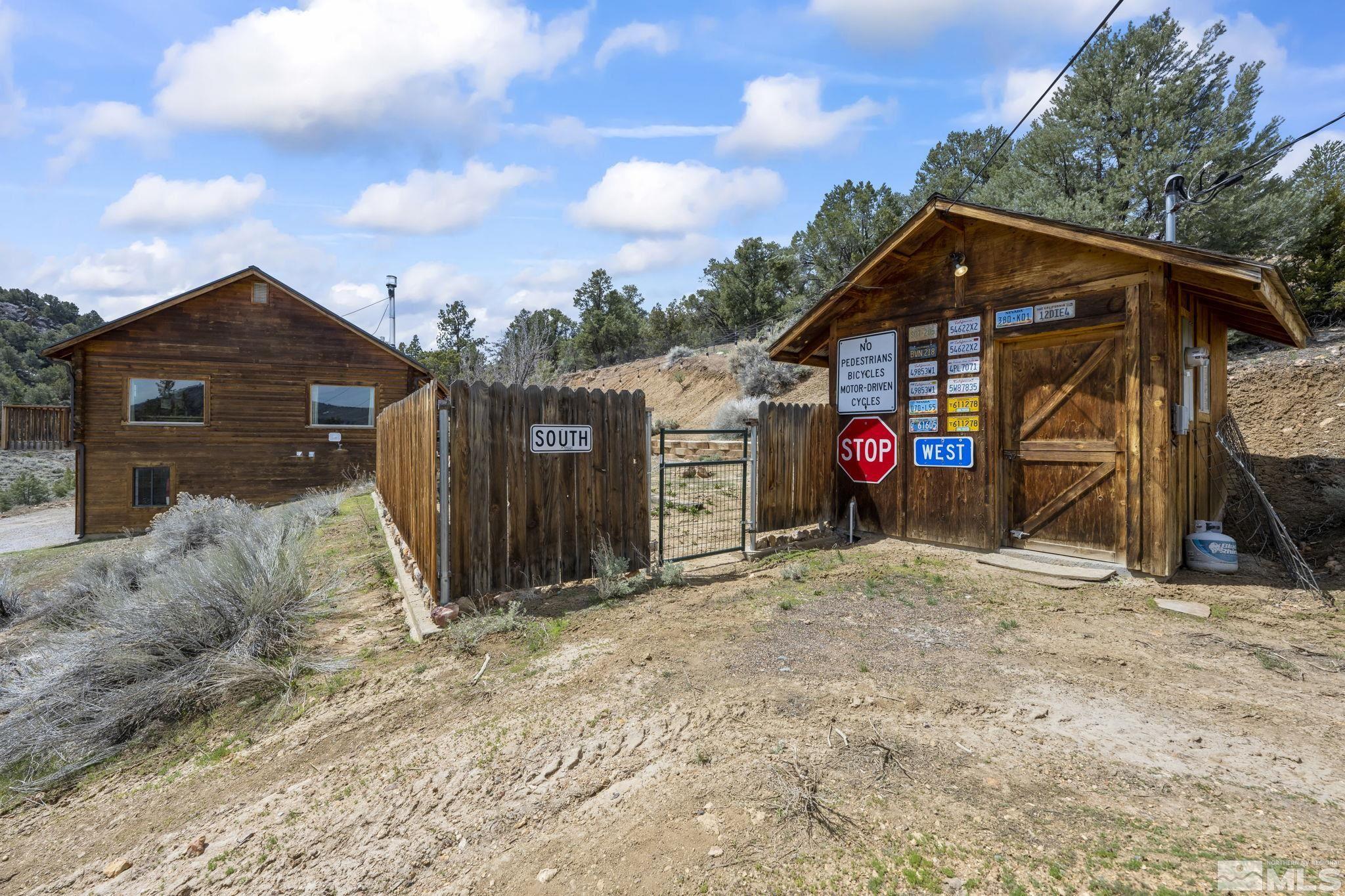 2200 Lousetown Road Reno, NV 89521 - Photo 40 of 40 a view of a wooden house with a large trees
