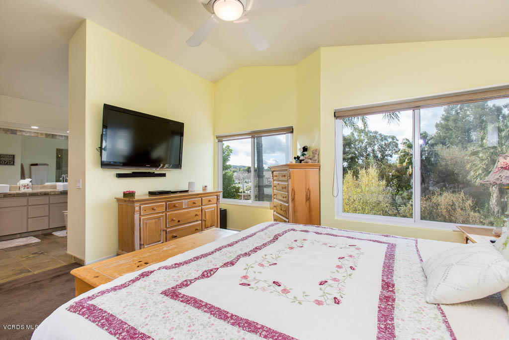 567 Galloping Hill Road Simi Valley, CA 93065 - Photo 21 of 36 a view of a bedroom with furniture and flat screen tv