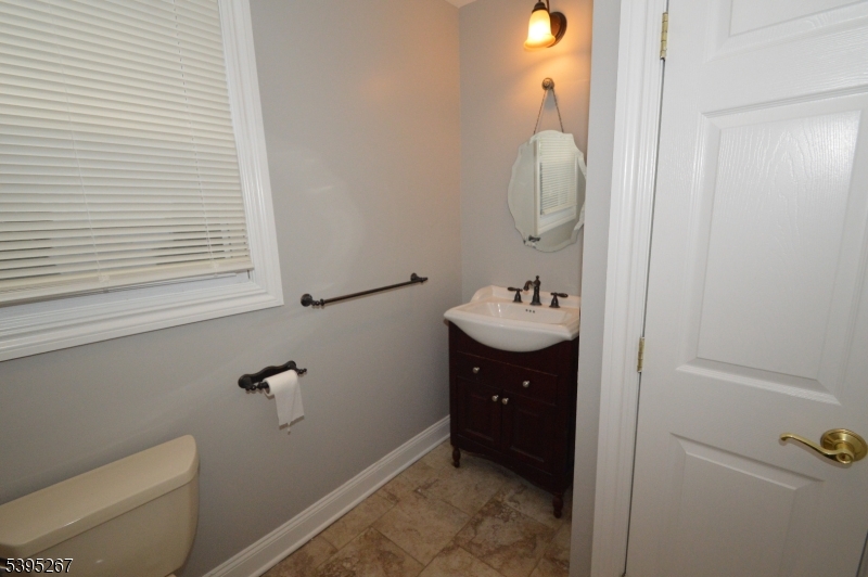 139 Forest Street, Unit 1 Montclair, NJ 07042 - Photo 12 of 23 a bathroom with a sink and mirror