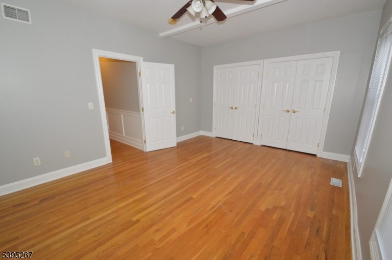 139 Forest Street, Unit 1 Montclair, NJ 07042 - Photo 14 of 23 wooden floor in an empty room