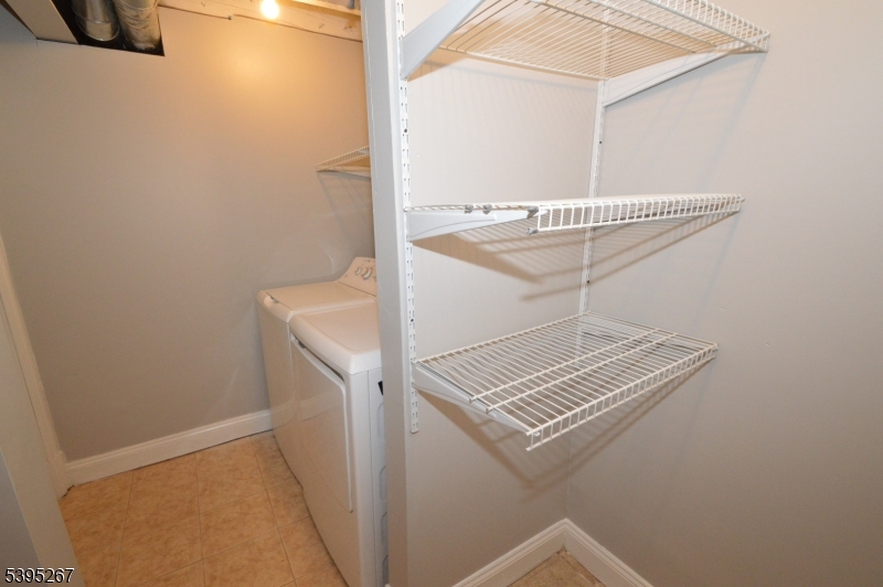 139 Forest Street, Unit 1 Montclair, NJ 07042 - Photo 16 of 23 a view of a hallway with washer and dryer