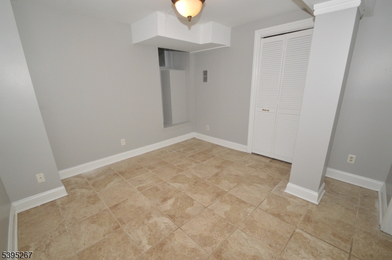 139 Forest Street, Unit 1 Montclair, NJ 07042 - Photo 20 of 23 an empty room with a window