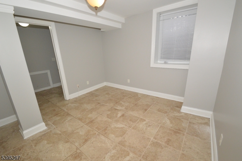 139 Forest Street, Unit 1 Montclair, NJ 07042 - Photo 21 of 23 an empty room with windows
