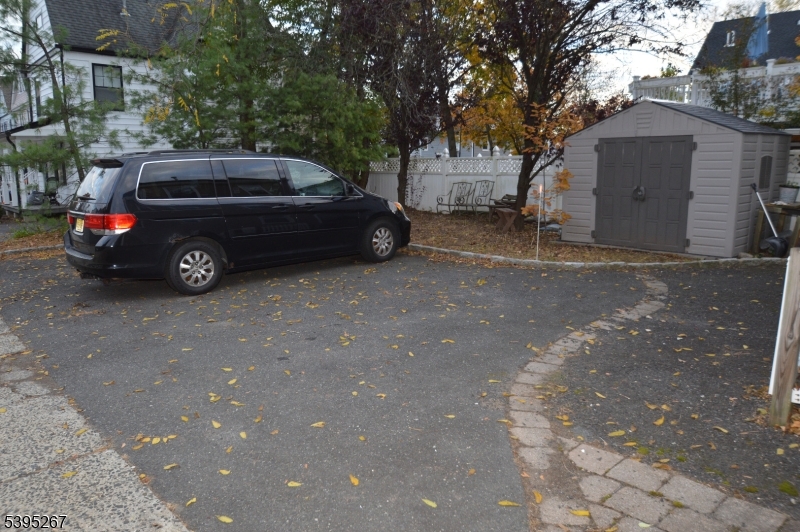 139 Forest Street, Unit 1 Montclair, NJ 07042 - Photo 22 of 23 a view of a car parked in back of a house