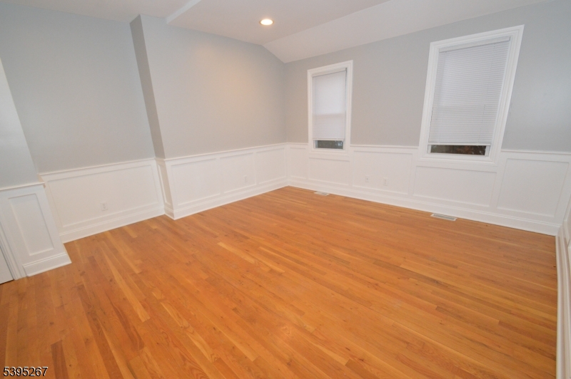 139 Forest Street, Unit 1 Montclair, NJ 07042 - Photo 4 of 23 a view of empty room with wooden floor