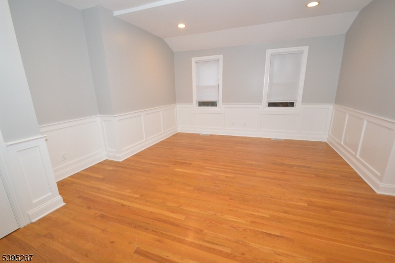 139 Forest Street, Unit 1 Montclair, NJ 07042 - Photo 7 of 23 a view of empty room with wooden floor