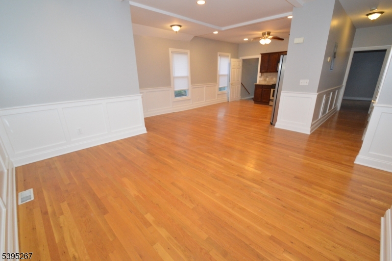 139 Forest Street, Unit 1 Montclair, NJ 07042 - Photo 9 of 23 a view of a big room with wooden floor and windows