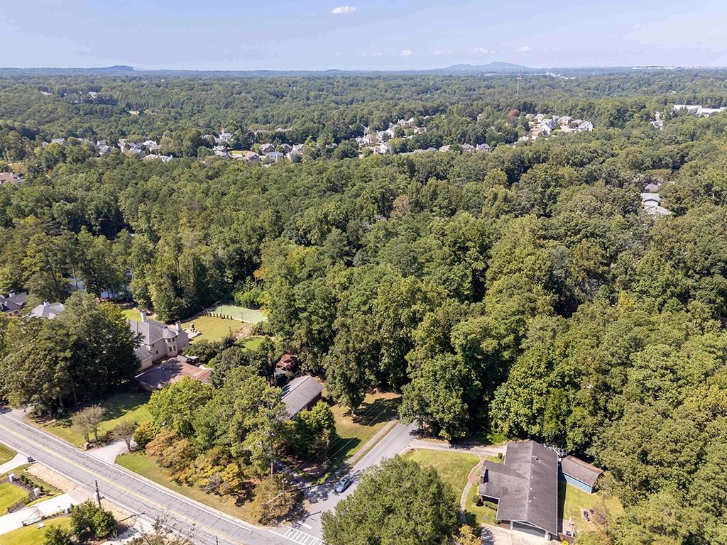4398 King Valley Drive Southeast Smyrna, GA 30082 - Photo 4 of 17 an aerial view of a residential houses covered in trees
