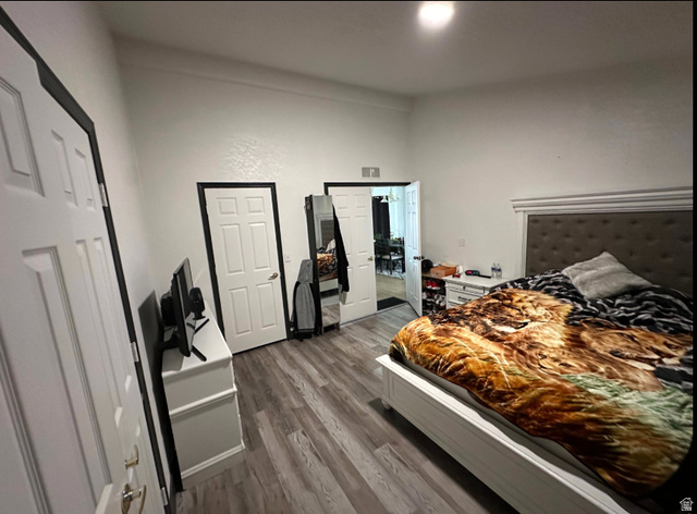 265 Mindella Way Layton, UT 84041 - Photo 22 of 32 Room featuring wood-finish flooring, white walls, and multiple paneled doors with contrasting trim