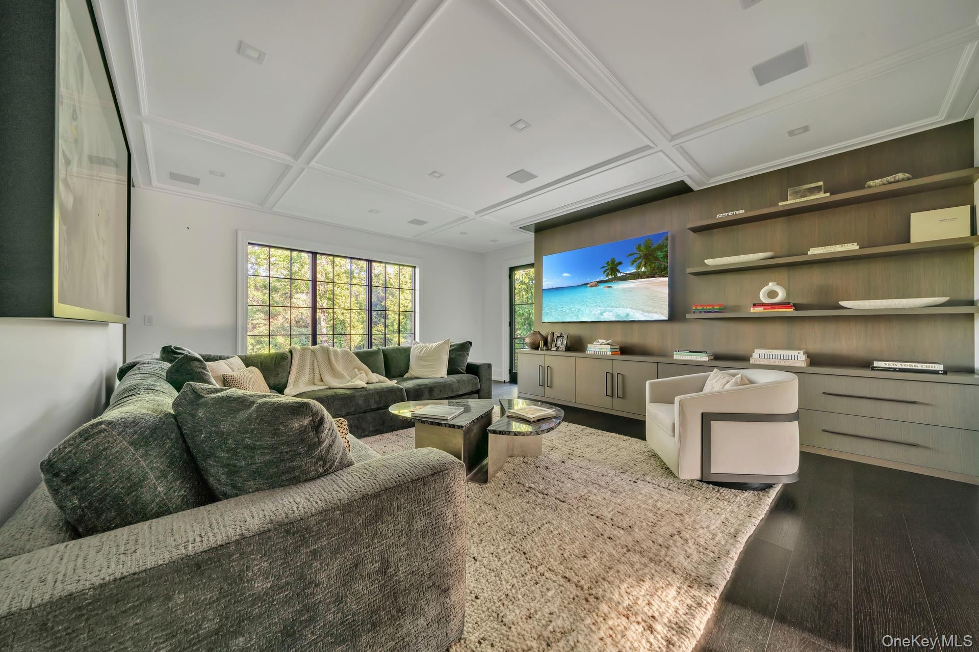 64 Cushman Road Scarsdale, NY 10583 - Photo 11 of 32 a living room with furniture and a flat screen tv