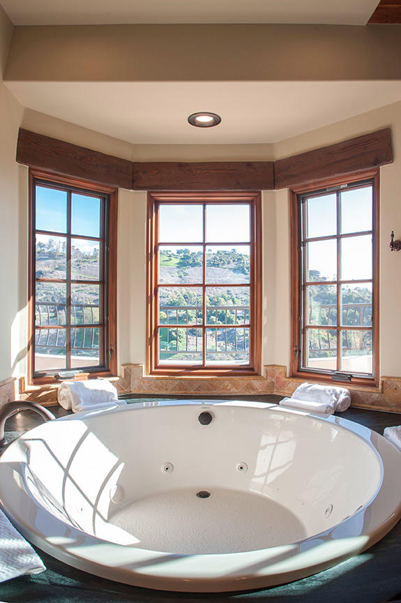 20 Alisal Road Santa Barbara, CA 93103 - Photo 16 of 32 a bath tub sitting in a bathroom next to a window